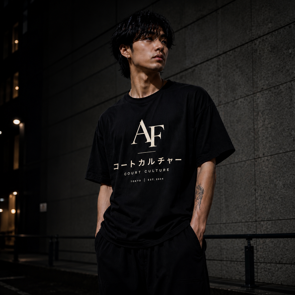 Person wearing a black t-shirt with 'AF' and Japanese text against a dark background