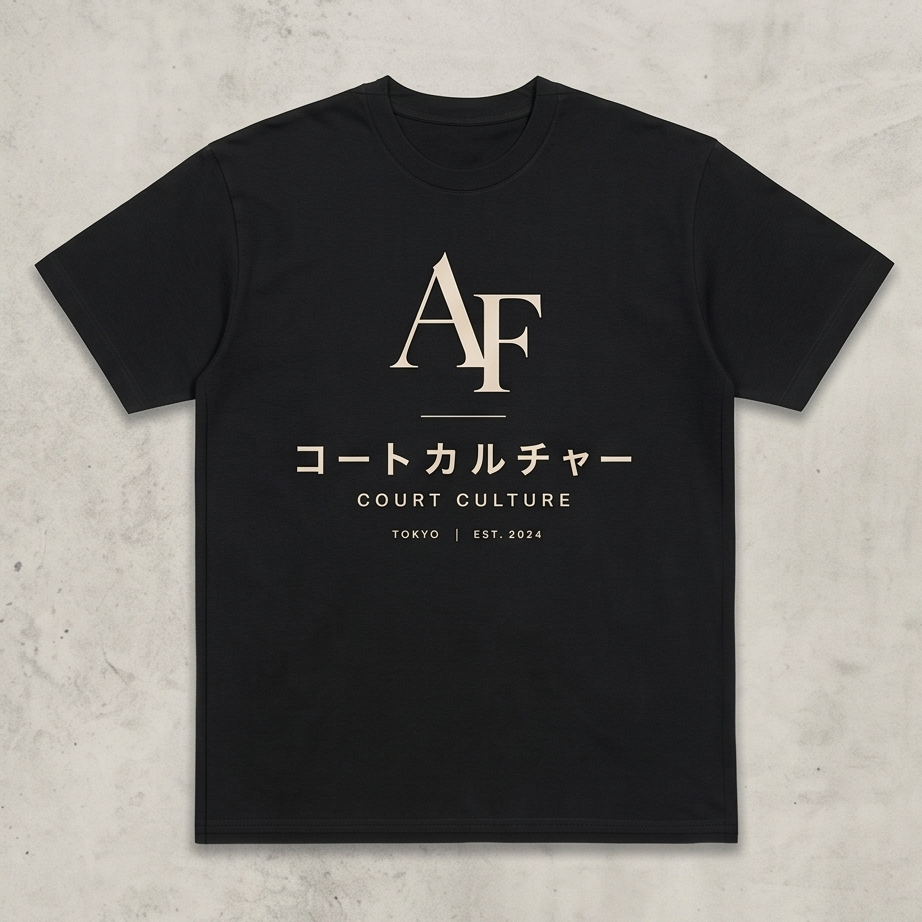 Black t-shirt with white text and logo on a textured gray background