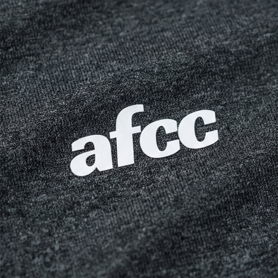 Close-up of a black fabric with 'afcc' logo in white.