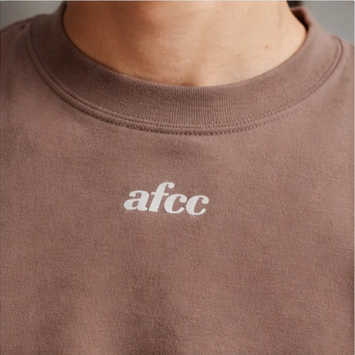 Brown sweatshirt with 'afcc' logo on a plain background