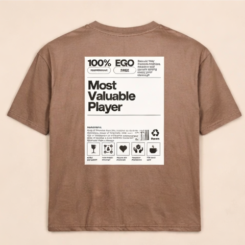 Brown t-shirt with a label design on the back against a beige background