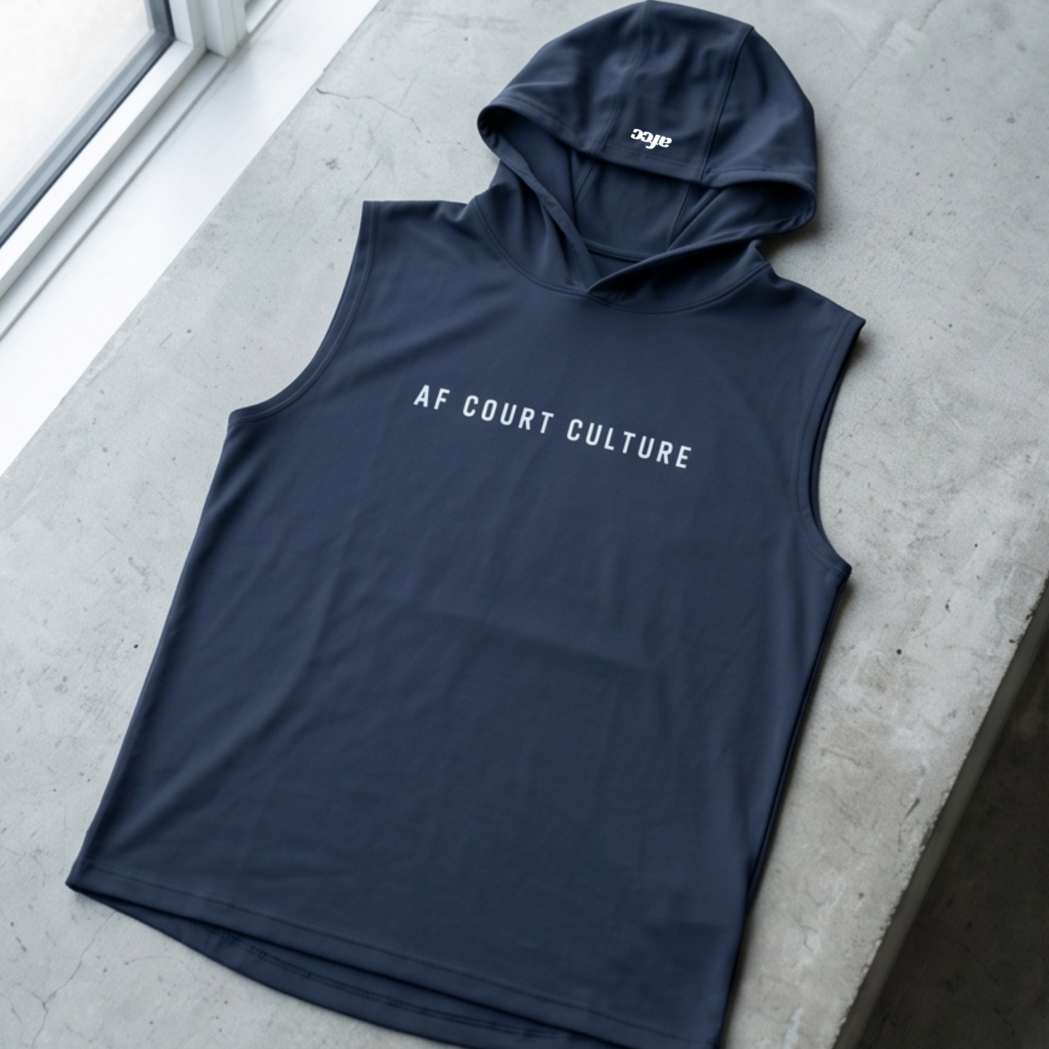 Navy sleeveless hoodie with 'AF Court Culture' text on a concrete surface.