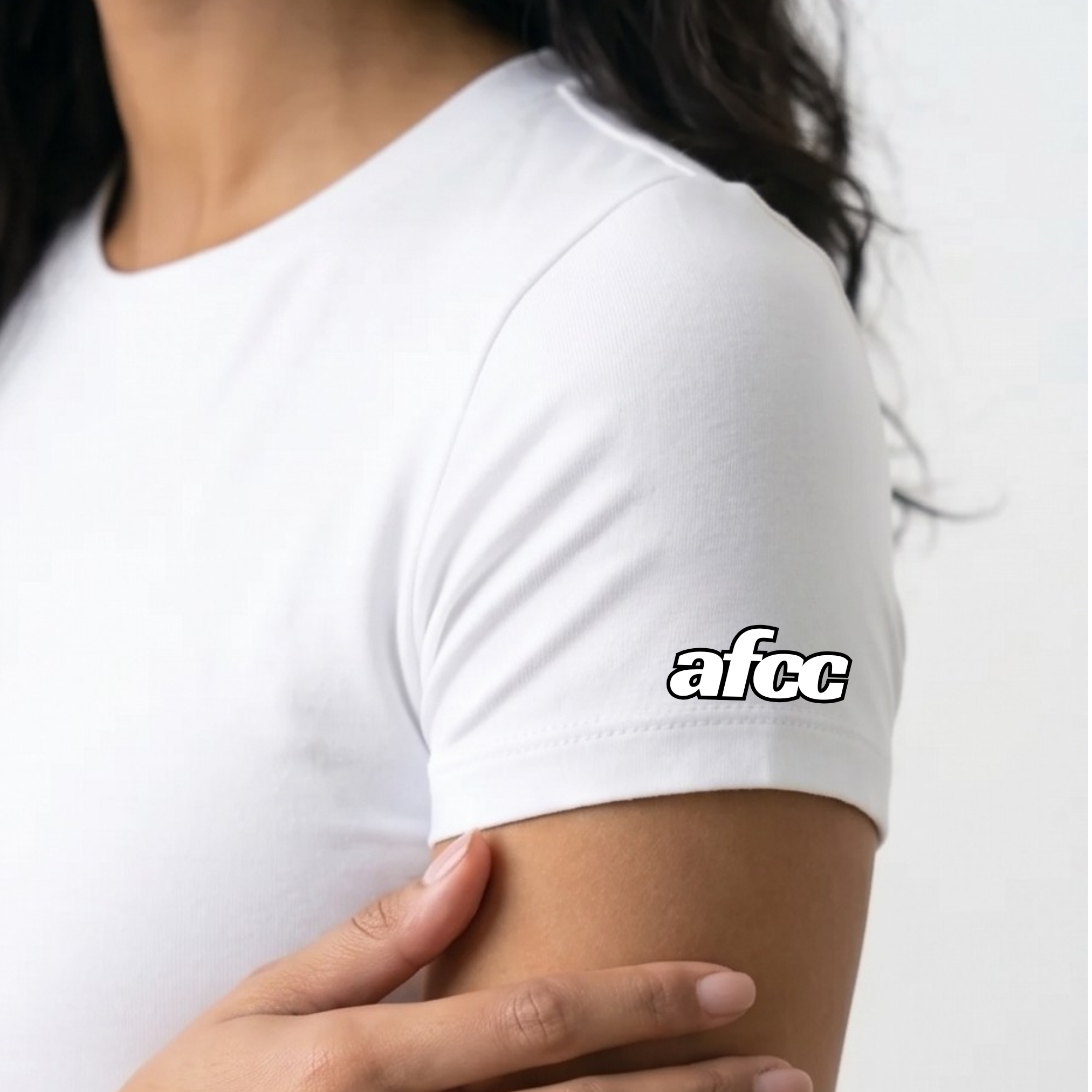 Person wearing a white t-shirt with 'afcc' logo on a plain background