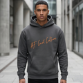 Man wearing a gray hoodie with 'AF Court Culture' text in an urban setting