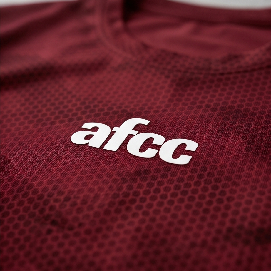 Maroon sports jersey with 'afcc' logo on a light gray background