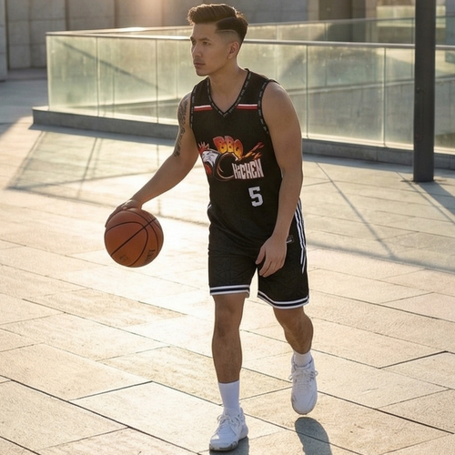 Person holding a basketball wearing a black sports jersey with a building in the background