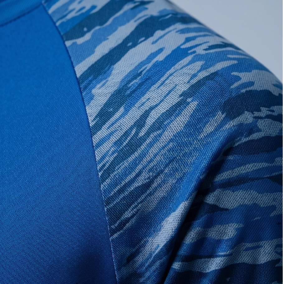 Blue fabric with a camouflage pattern on a blue background