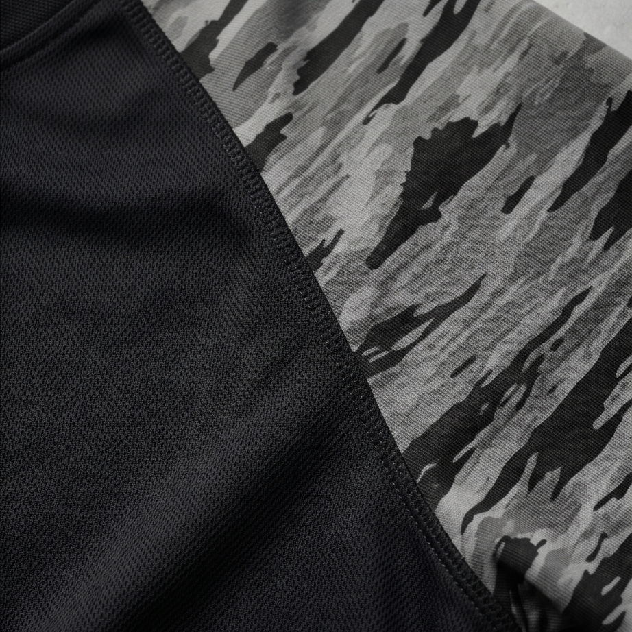 Close-up of black fabric with a camouflage pattern